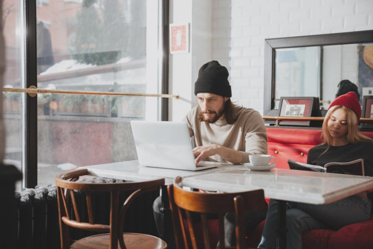 Person reviewing financial statements at desk